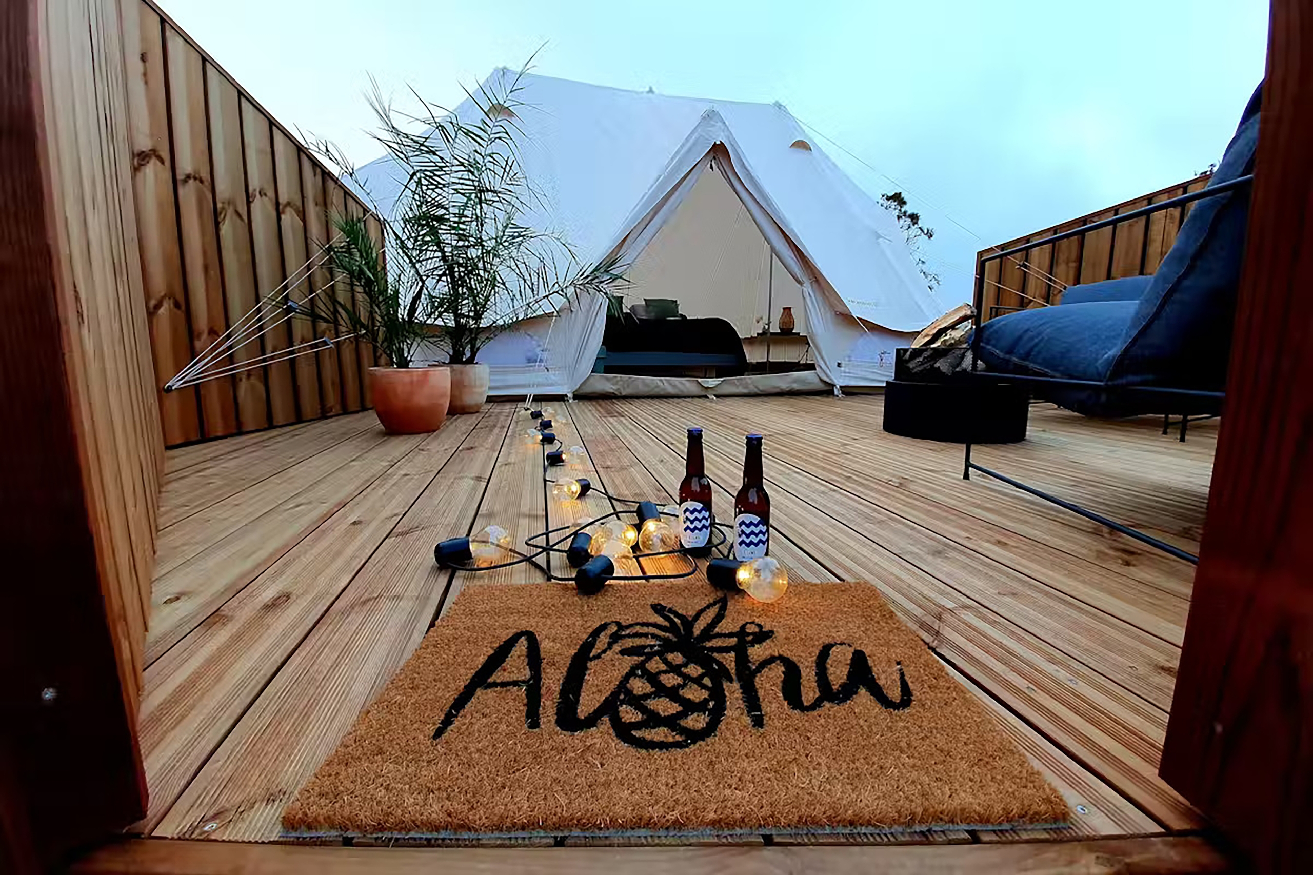 The chic glamping tents even have their own wooden deck. 
